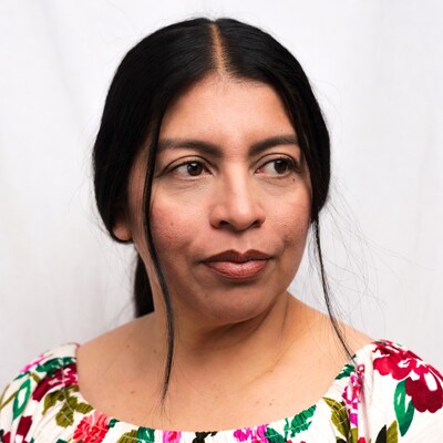 Latina woman in floral top