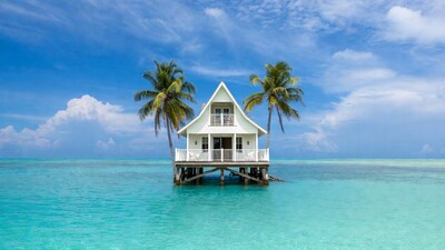 White house on stilts in turquoise lagoon