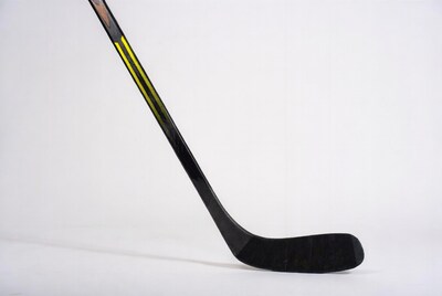 Black hockey stick with yellow stripes