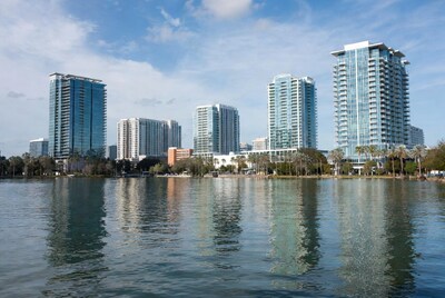 Modern skyscrapers reflecting in lake