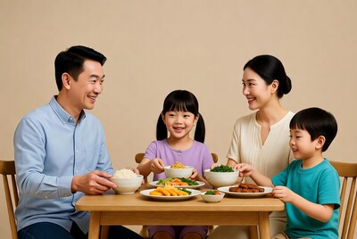 Asian family eating dinner together