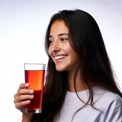 Asian girl smiling with red drink