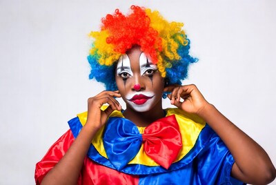 Black woman in colorful clown costume