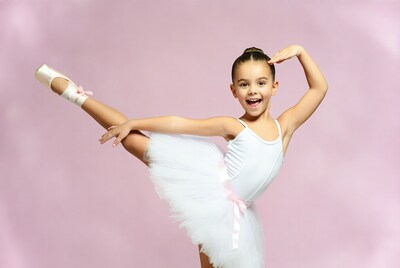 Young girl doing ballet pose