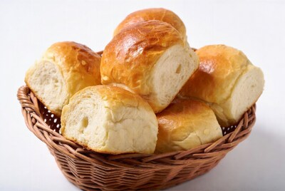 Fresh bread rolls in wicker basket