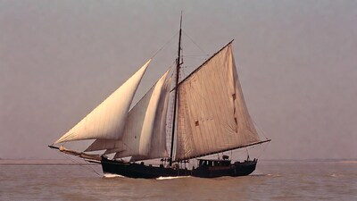 Schooner sailing on river