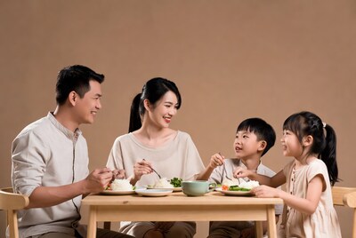 Asian family eating dinner together
