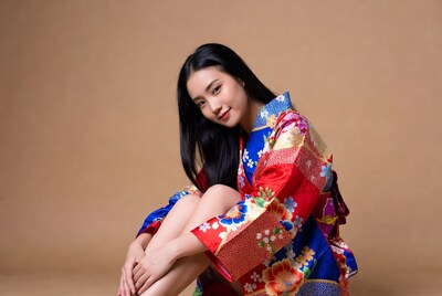 Asian woman in colorful kimono sitting