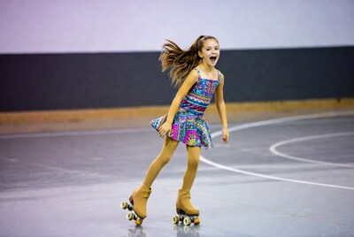 Girl roller skating on rink