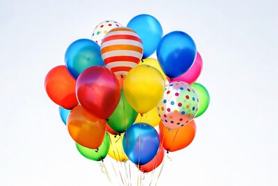 Colorful Balloons Cluster on White Background