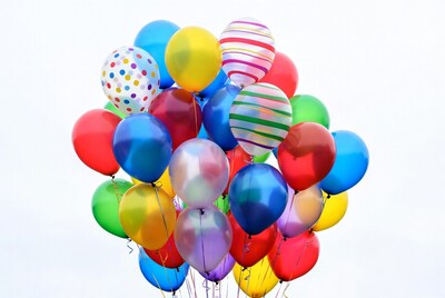 Colorful Balloons Cluster on White Background