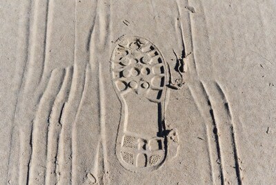 Sneaker footprint in sand