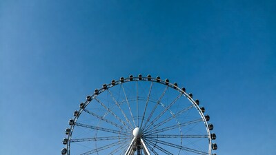 Ferris wheel against blue sky