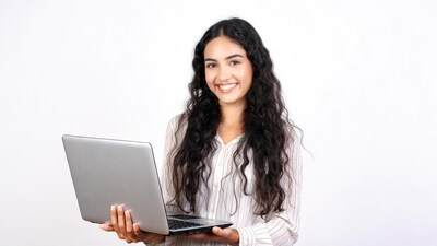 Smiling woman holding laptop