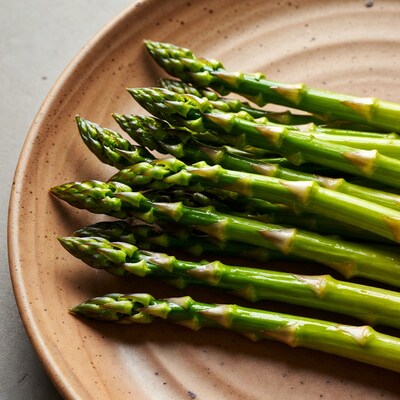 Fresh asparagus spears on plate