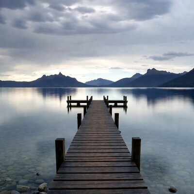 Wooden pier extending into calm lake