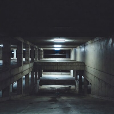 Empty Concrete Parking Garage at Night