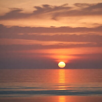 Sunset over calm ocean