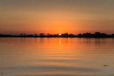 Sunset over lake with trees