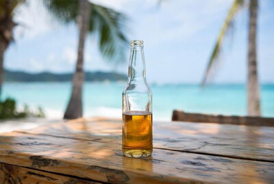 Beer bottle on beach table