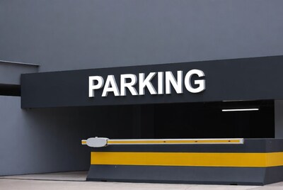 Parking Sign on Gray Building
