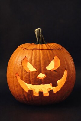 Lit Jack-o'-lantern on black background