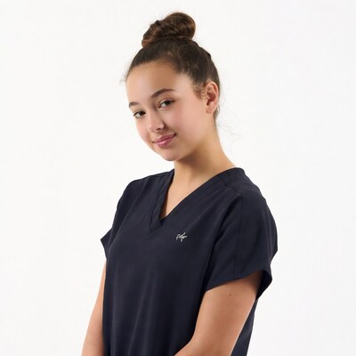 Teen girl in navy scrubs smiling