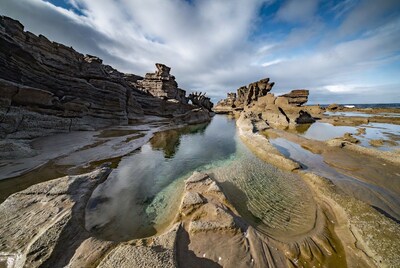 Rock Pools Amid Eroded Coastal Cliffs