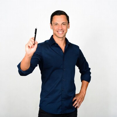 Man holding pen smiling