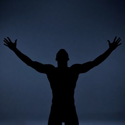 Muscular man silhouette raising arms