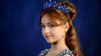 Girl wearing blue crown and dress