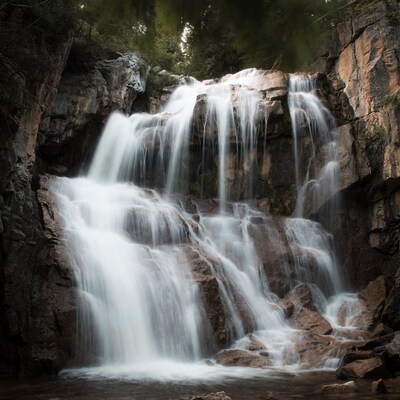 Cascading Waterfall in Rocky Forest