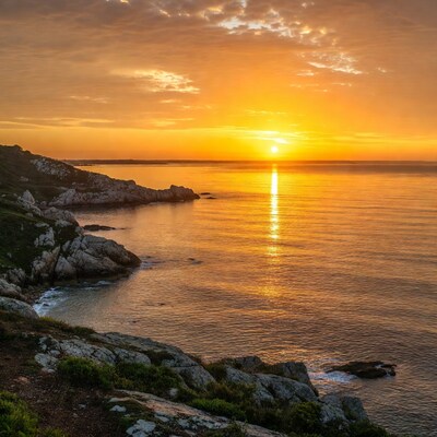 Sunset over rocky coastline