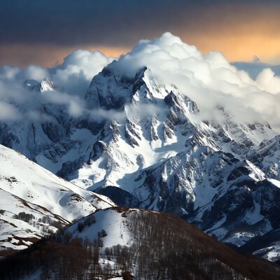 Snowy Mountain Peak with Clouds