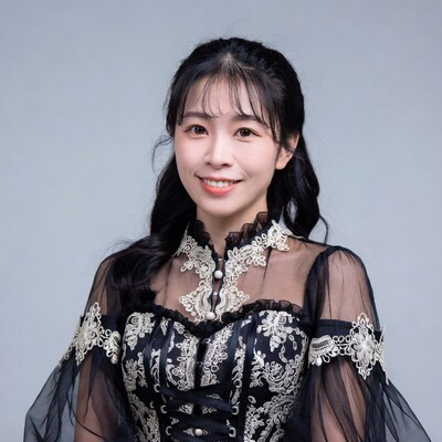 Asian woman in black lace corset dress