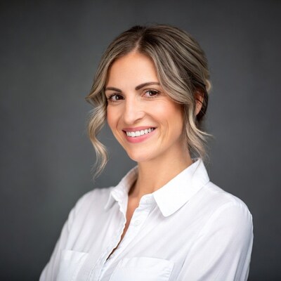 Smiling woman with arms crossed