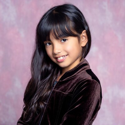 Asian girl smiling in velvet jacket
