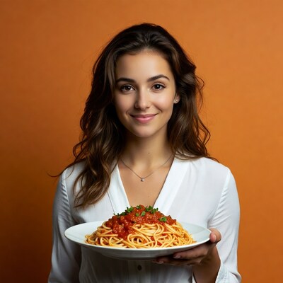 Woman holding spaghetti plate