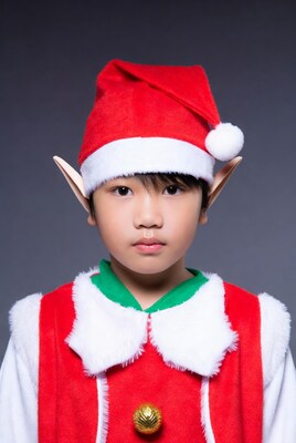 Asian boy in elf costume