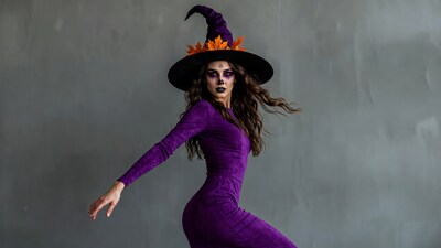 Woman in purple witch costume dancing
