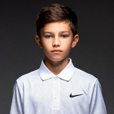 Boy in white Nike polo shirt