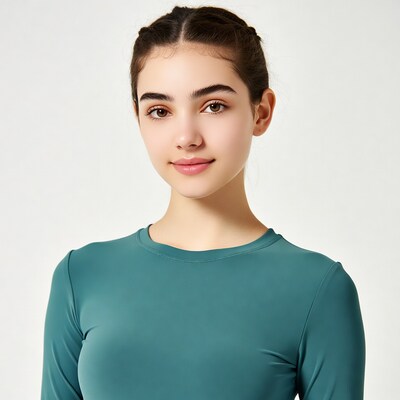 Teen girl in teal top smiling