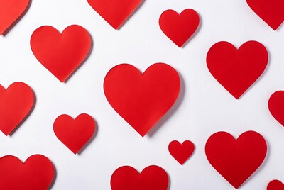 Red paper hearts on white background