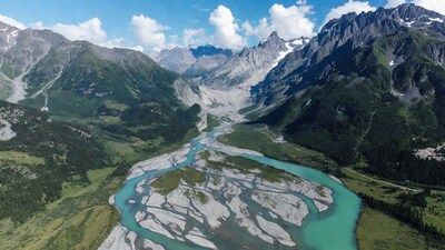 Aerial view turquoise river alpine valley