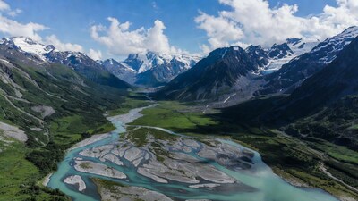 Turquoise River in Snowy Mountain Valley
