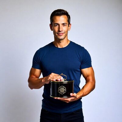 Muscular man holding black tin