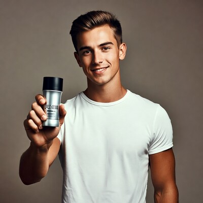 Handsome man holding Axe deodorant
