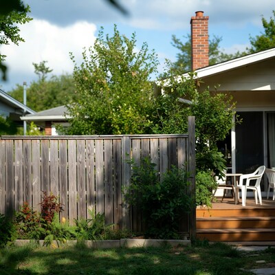 Wooden fence with backyard deck