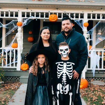 Family in Halloween Costumes on Porch