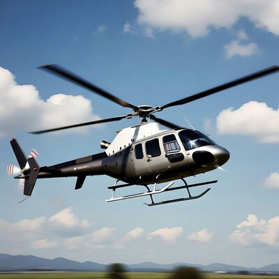 Black Helicopter Flying over Mountains